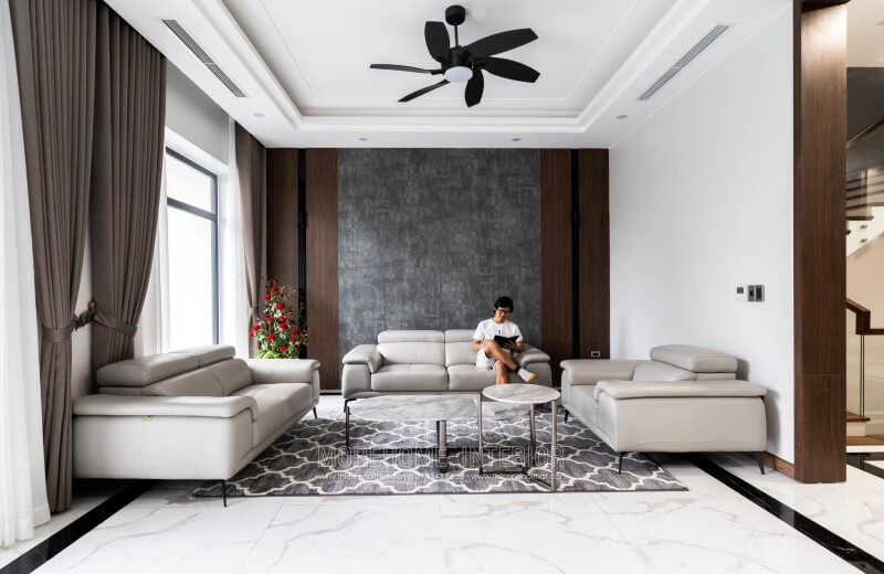 Công trình thi công nội thất phòng khách biệt thự hiện đại với đồ nội thất sofa bọc da sang trọng tại Nghệ An Thi công nội thất biệt thự